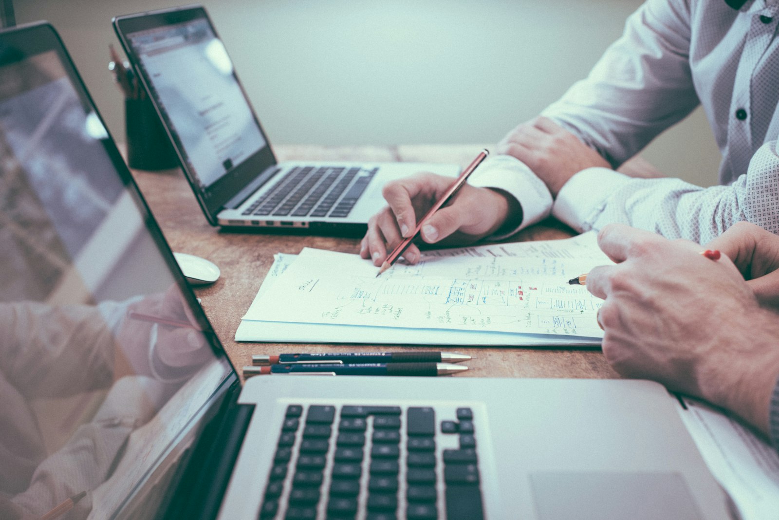Insurance research desk analyzing actuarial data and policy binders